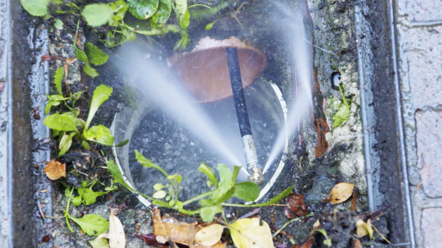 Unclogging manholes, gutters and house drains with the high-pressure ...